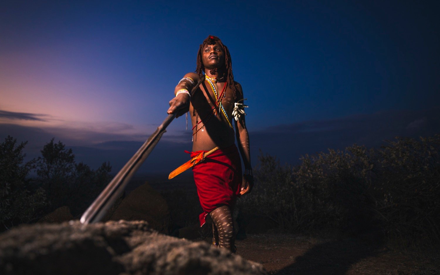 Three Maasai warriors on the savannah